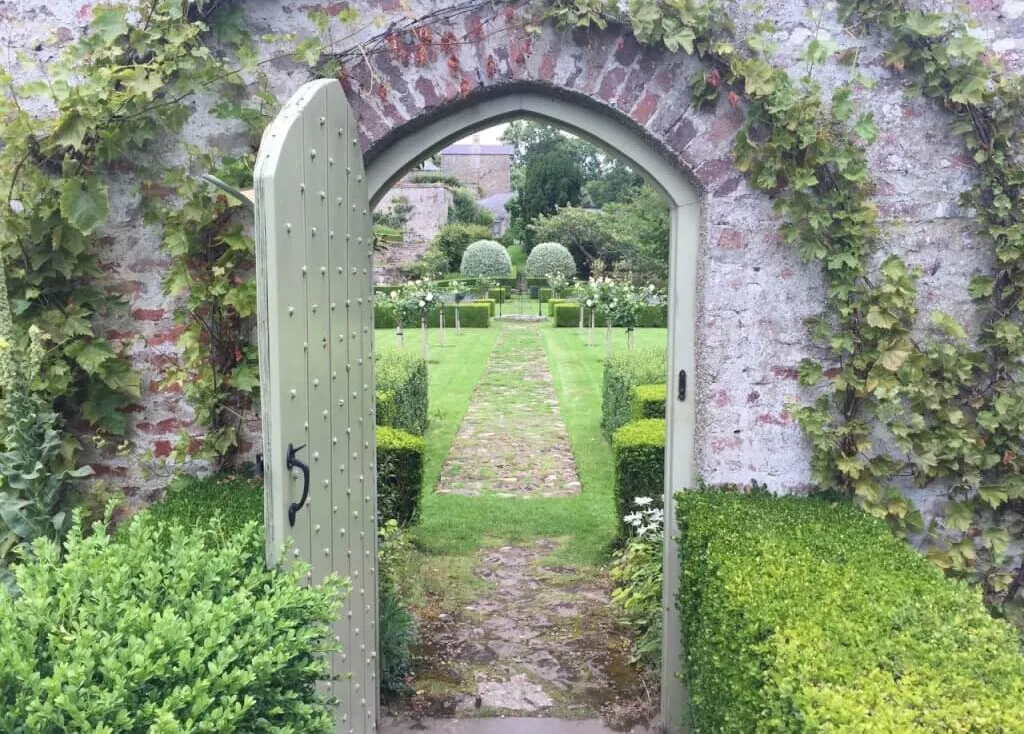 A romantic gate leading through to a garden