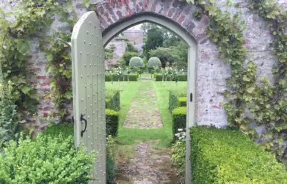 A romantic gate leading through to a garden