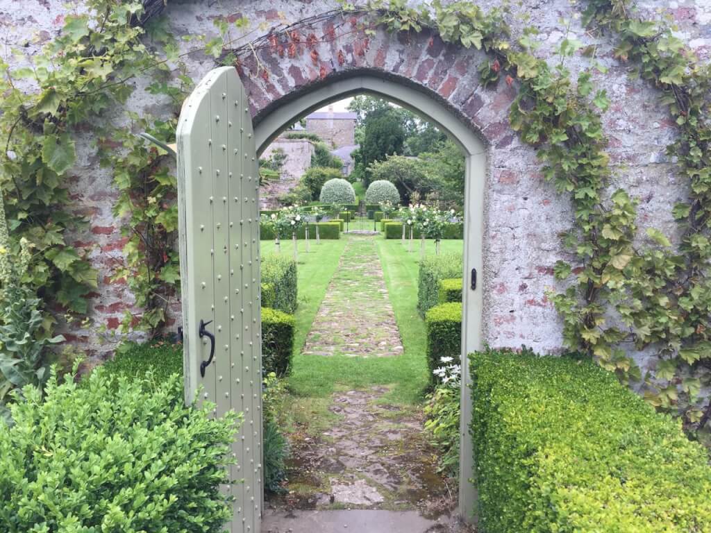 A romantic gate leading through to a garden
