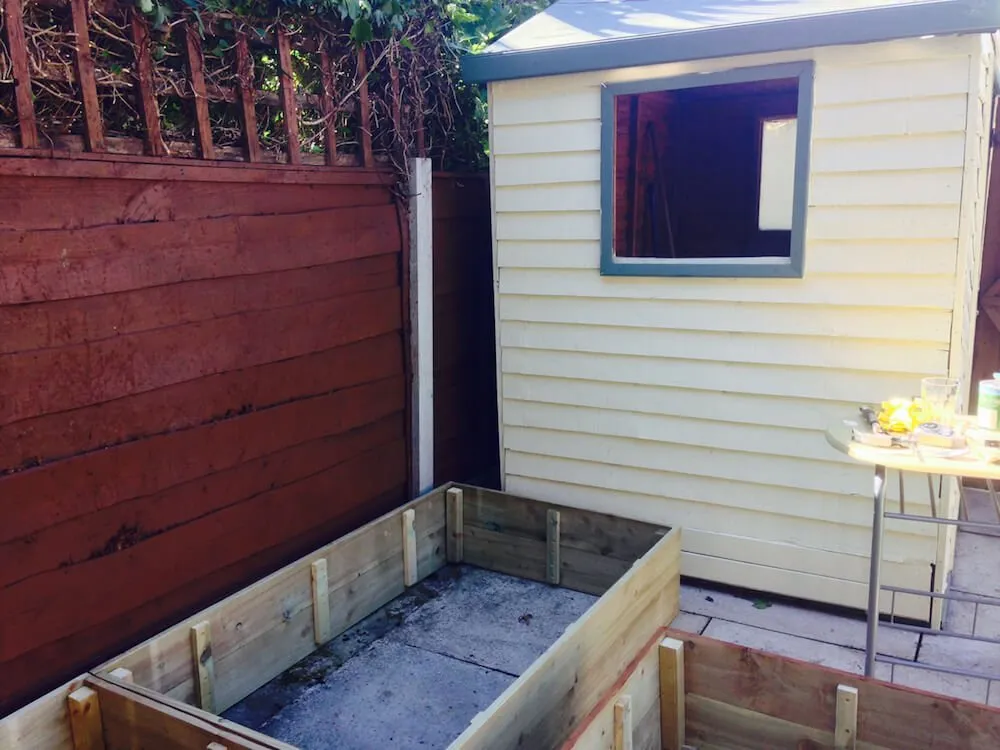 A garden transformation with raised beds being installed