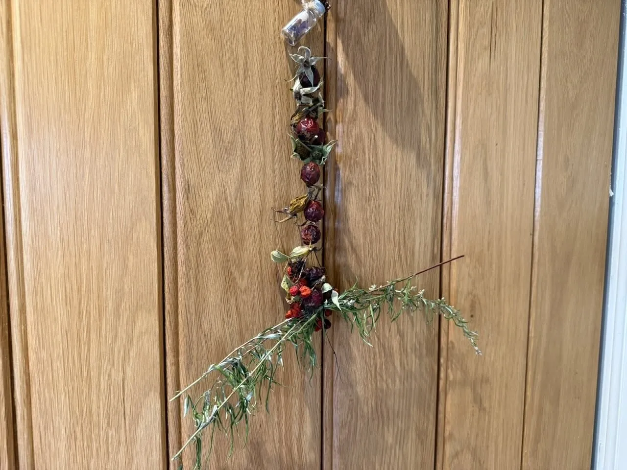 A rose hip and mugwort charm for protection