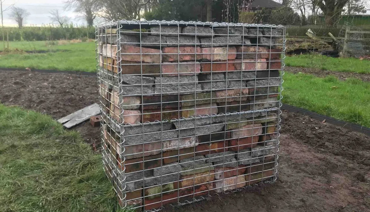 A full gabion box using reclaimed garden materials