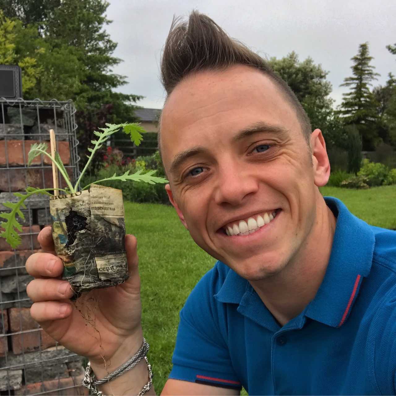 Lee Burkhill holding a plug plant