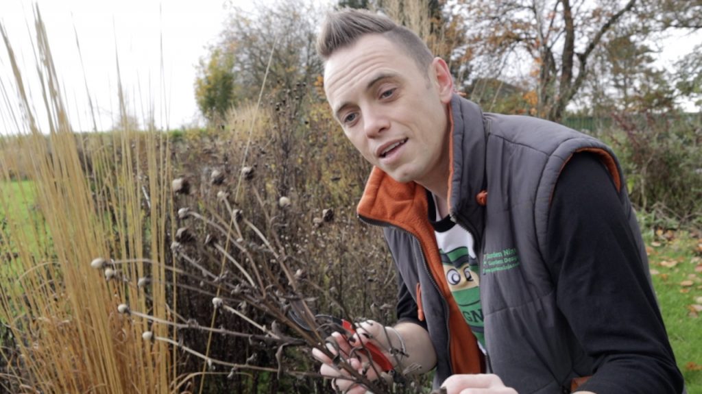 Garden Ninja Lee Burkhill holding flowers