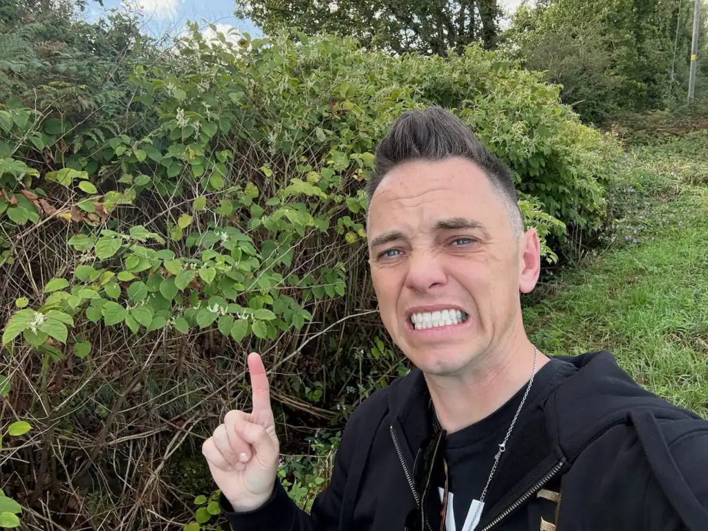 Lee Burkhill pointing out a dense stand of Japanese knotweed