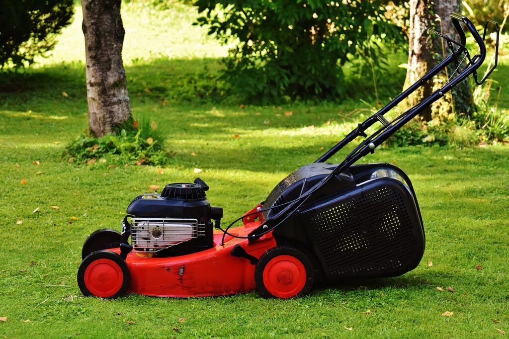 A red petrol powered lawn mower