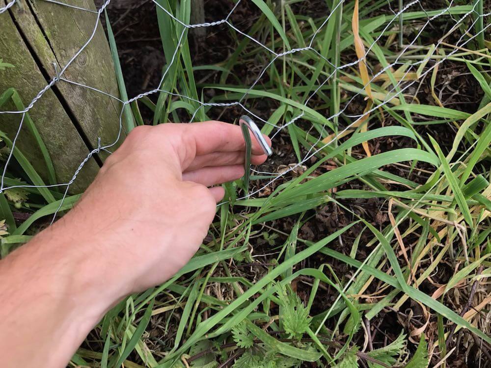 Garden Ninja holding a tent peg