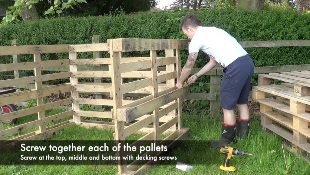 Screwing together a compost bin