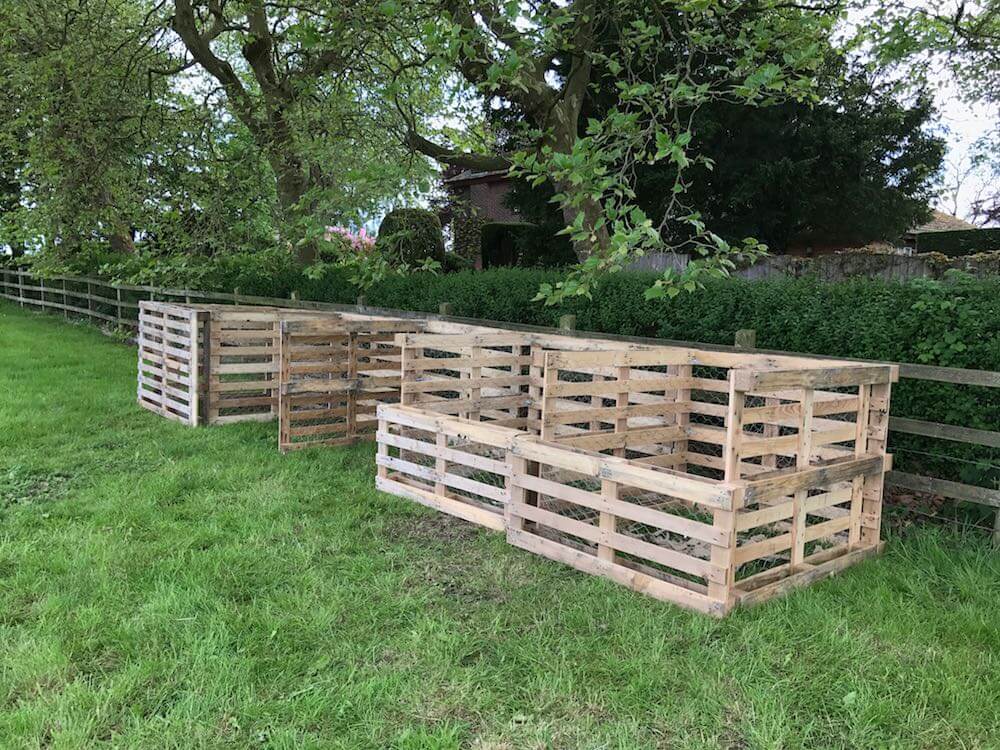 A set of 4 hand made compost bins from pallets