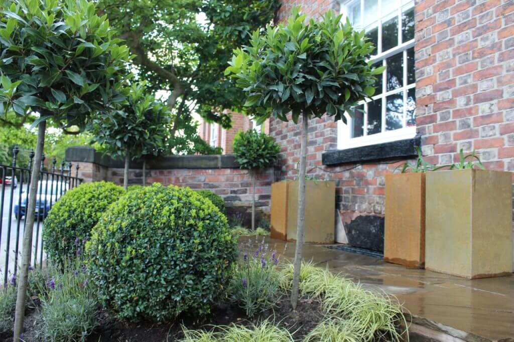 Two Corten steel planters in a modern front garden makeover