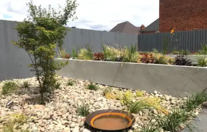 A modernist garden design by Garden Ninja with Corten steel water bowl
