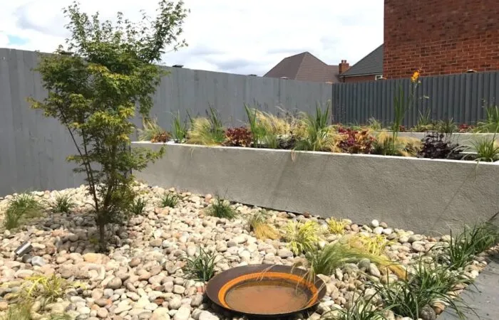 A modernist garden design by Garden Ninja with Corten steel water bowl
