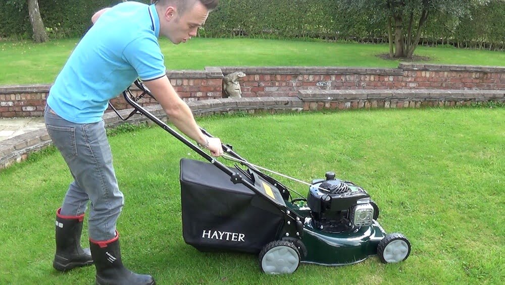 Lee Burkhill the Garden Ninja starting a Hayter Lawn Mower