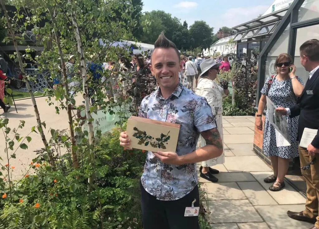 Garden Ninja holding his Chelsea Award