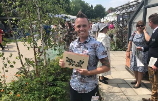 Garden Ninja holding his Chelsea Award
