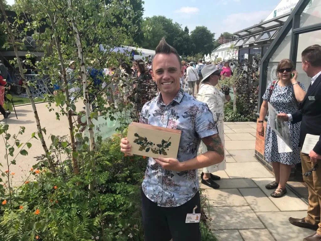 Garden Ninja holding his Chelsea Award