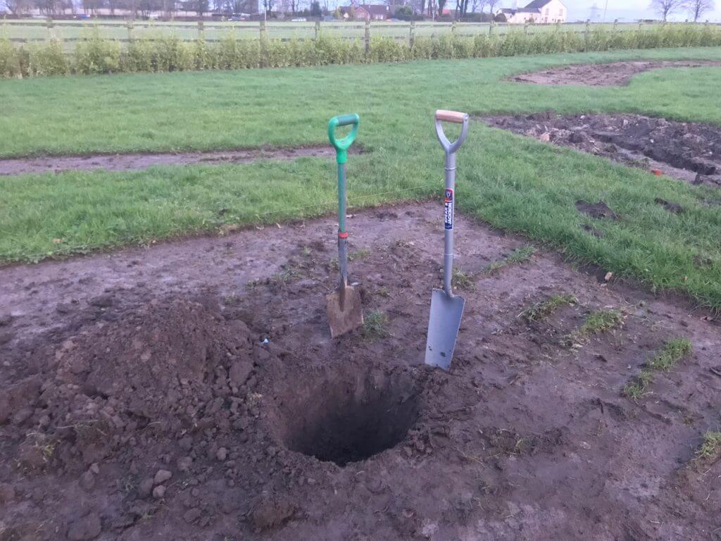 Digging a tree pit with a spade