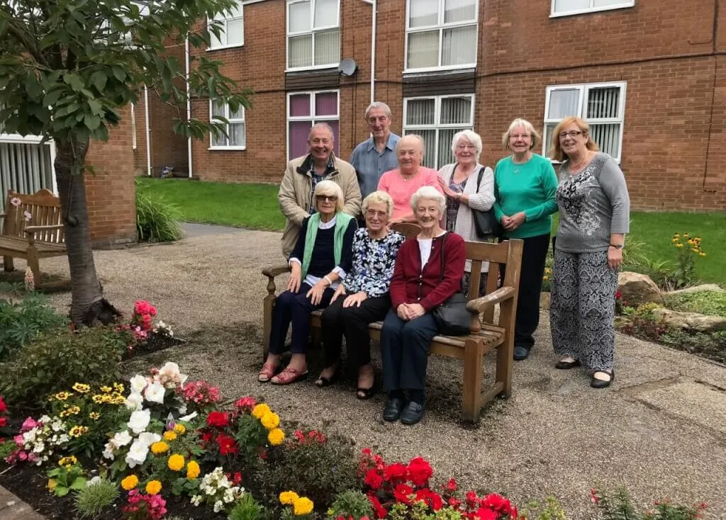 Community garden residents sat on a bench