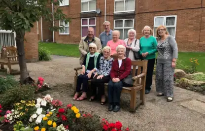 Community garden residents sat on a bench