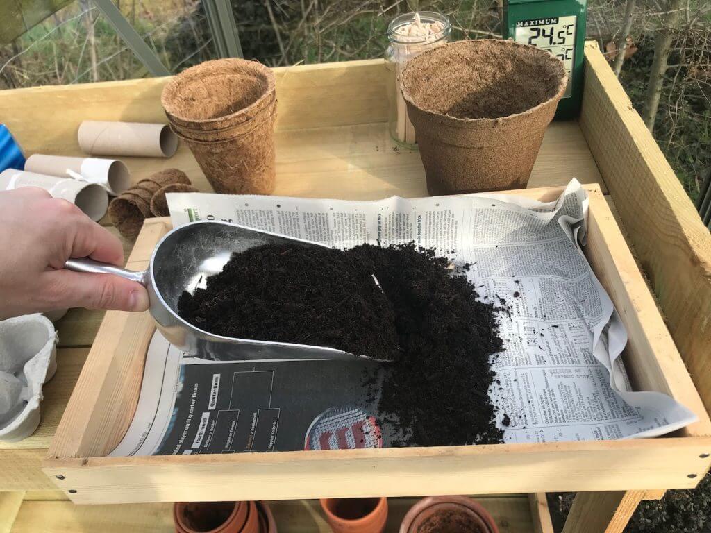 Garden Ninja filling a wooden seed tray