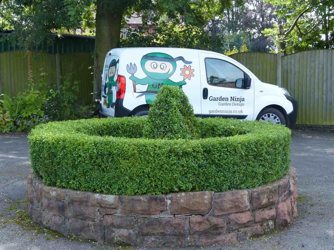 Clipped box hedging and topiary
