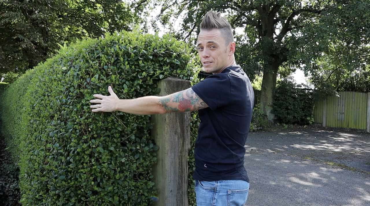 Lee Burkhill demonstrating how to cut a hedge