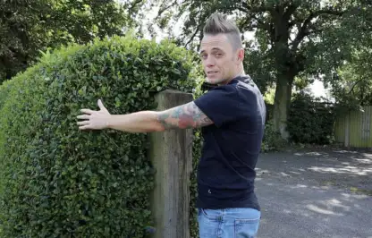 Lee Burkhill demonstrating how to cut a hedge