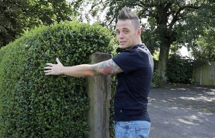Lee Burkhill demonstrating how to cut a hedge