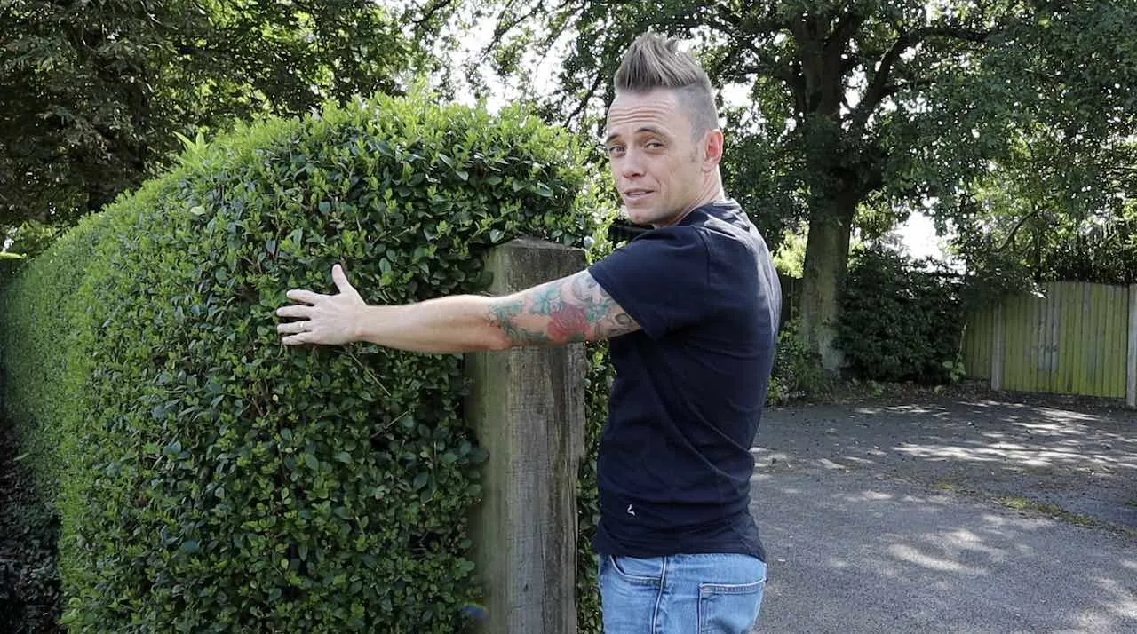 Lee Burkhill demonstrating how to cut a hedge
