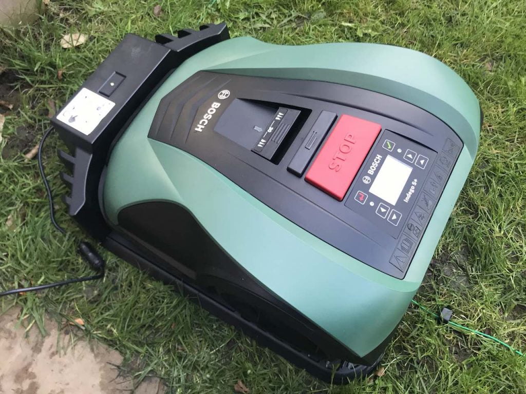 Green BOSCH robot mower on grass
