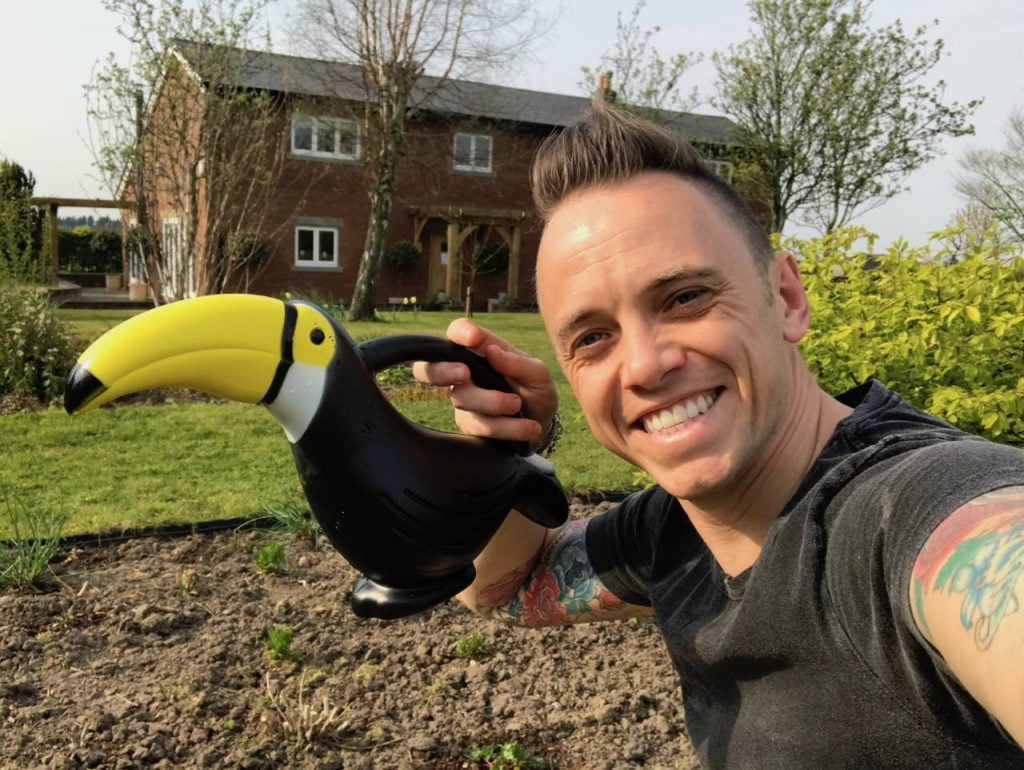 Garden Ninja holding a watering can