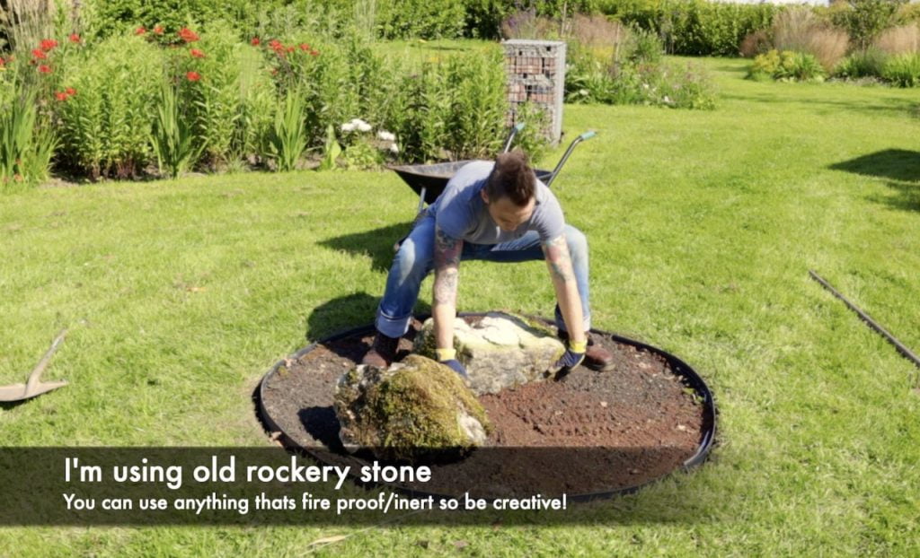 Adding stones to a fire pit