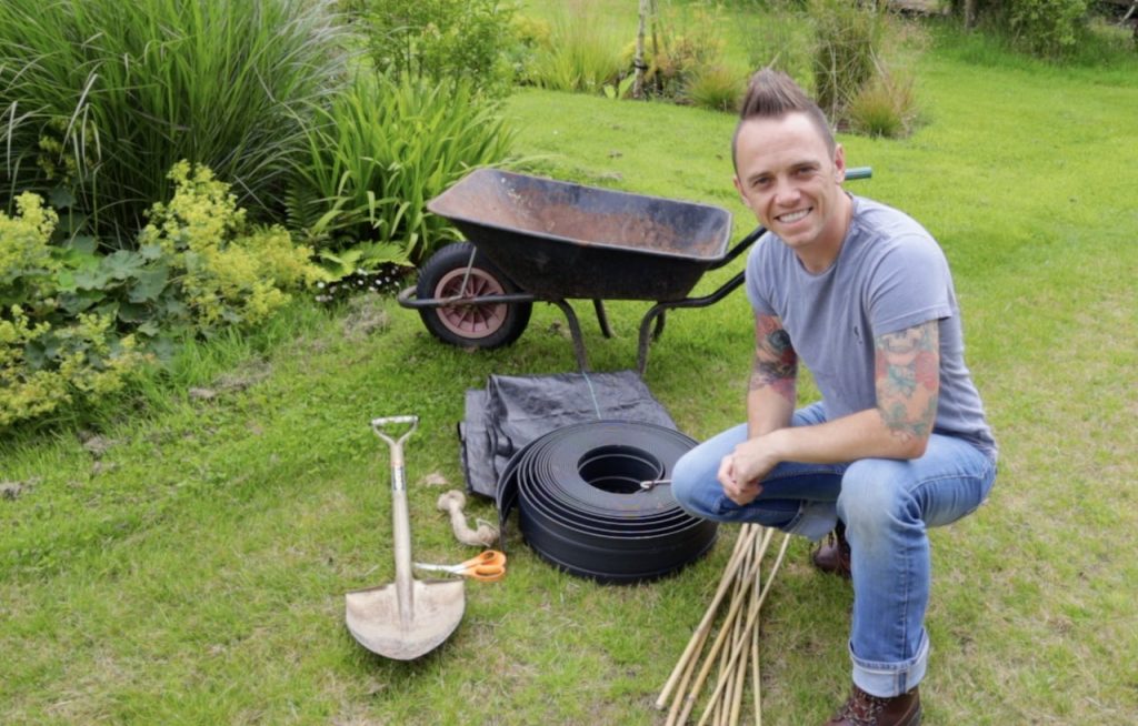 Garden Ninja next to a garden wheelbarrow