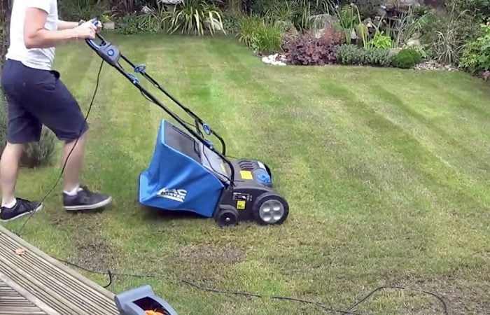 Scarifying a lawn with a powered scarifier