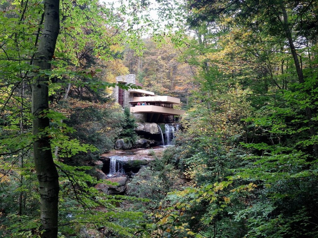 A modernist house and waterfall