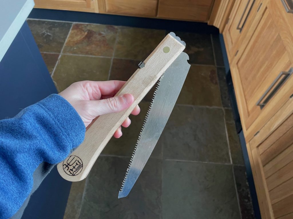 Folding saw half open