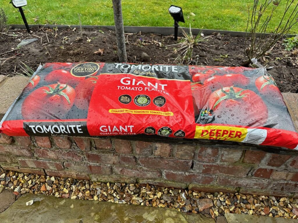 Tomato grow bag on a wall