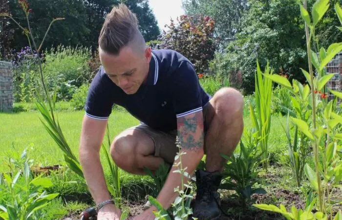 Garden ninja Lee Burkhill planting a border with seedlings