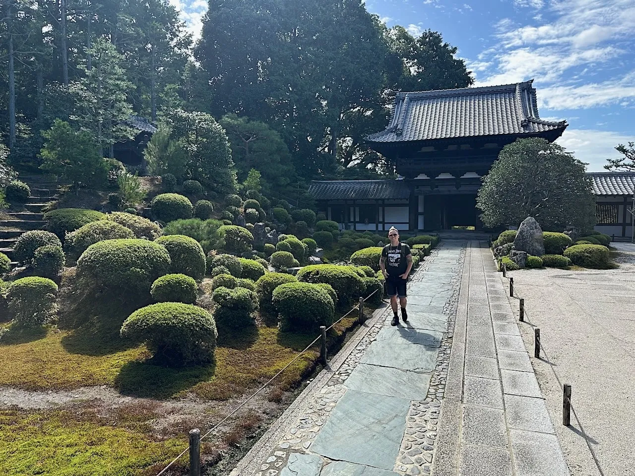 Garden Ninja Lee Burkhill walking on a Japanese pathway in Japan