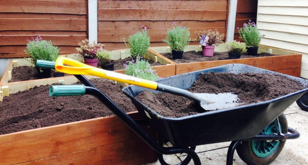 Filling a raised bed with soil