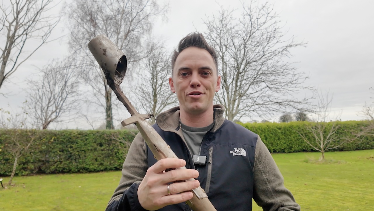Lee Burkhill using a long-handled bulb planter