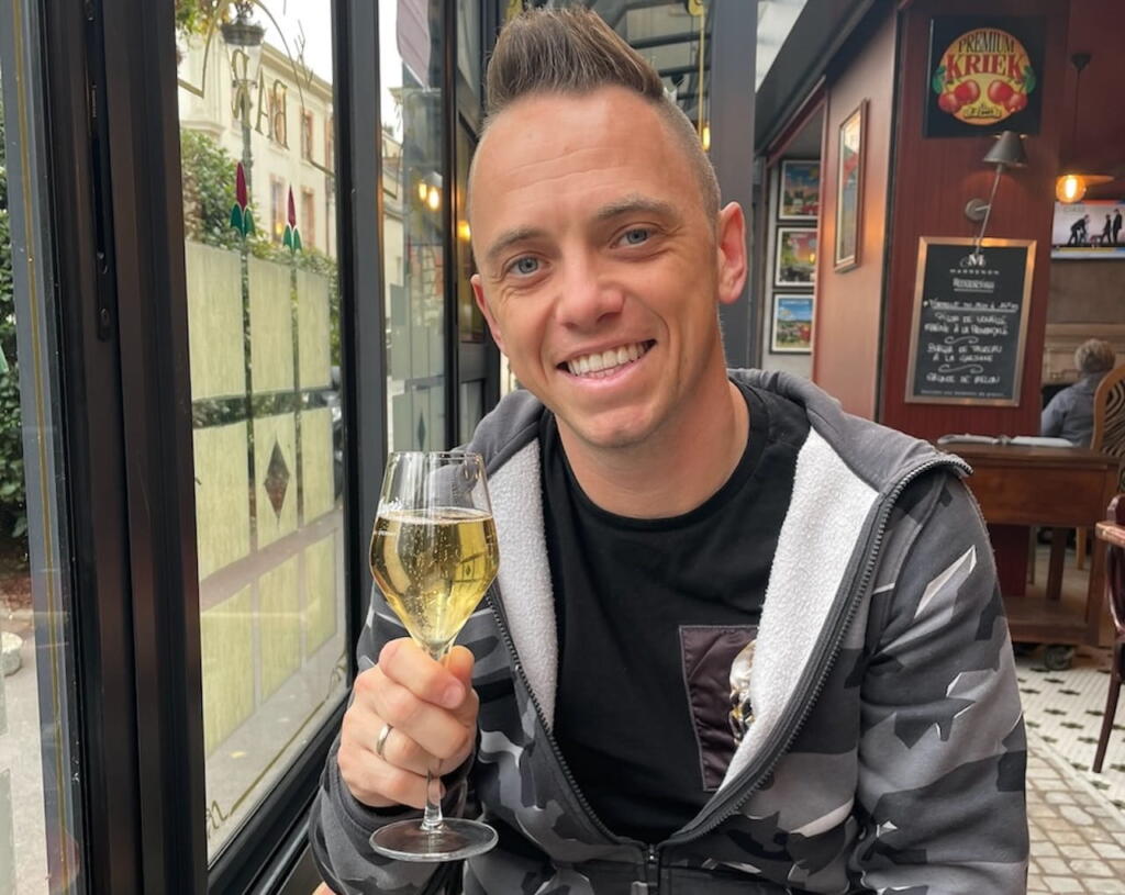 Lee Burkhill with champagne