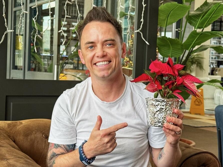 Lee Burkhill holding a poinsettia